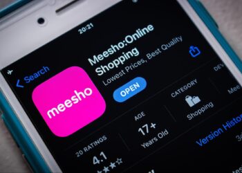 Smartphone screen displaying the Meesho app page on the App Store. The app icon is pink with "meesho" in white text. It has a 4.1-star rating from 20 ratings, is for users aged 17+, and is categorized under Shopping. The description reads "Lowest Prices, Best Quality." For support, contact Meesho Customer Care Number. | FintechZoom