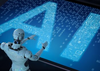 A humanoid robot interacts with a large digital display showing the letters "AI" made of glowing circuitry patterns. The background features binary code and a futuristic tech design, hinting at the innovative potential driving OpenAI stock. | FintechZoom
