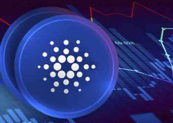 A digital rendering of the Cardano (ADA) cryptocurrency logo, featuring white dots forming a circular pattern on a blue coin. Behind the coin is a graphical chart with upward and downward red and green lines on a dark background, indicating financial data trends in the ongoing XLM vs ADA market. | FintechZoom