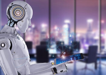 A humanoid robot interacts with a holographic display, showcasing a digital network of human icons and Robo Advisors. The scene is set in a modern office with large windows, offering a cityscape view with blurred lights in the background. | FintechZoom