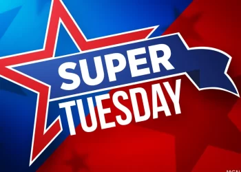 Bold text reads "Super Tuesday" on a dynamic background of red and blue split diagonally. A star outline extends from the left edge, and the word "Super" is enclosed in a banner shape, while "Tuesday" proudly sits beneath it. | FintechZoom