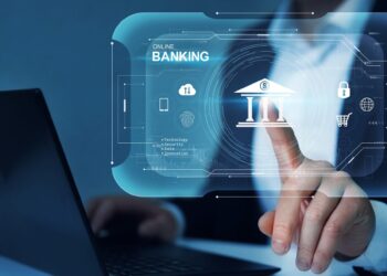 A person interacting with a digital interface displaying "Online Banking" icons, including a bank, security shield, and shopping cart. The person is using a laptop, highlighting the best neobanks and the concept of secure online financial transactions and services. | FintechZoom