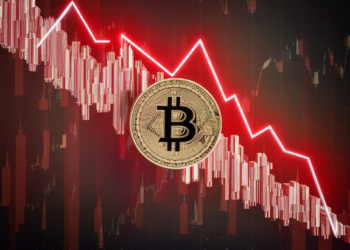 A gold Bitcoin symbol is placed against a background of a red descending line graph and red bar chart, illustrating the sharp decline in value, prompting viewers to ask, "Why is Bitcoin Going Down?" The image starkly conveys the downturn in Bitcoin or cryptocurrency prices. | FintechZoom