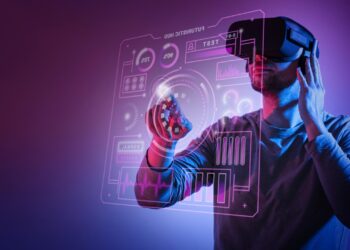 A person wearing a virtual reality headset interacts with a holographic interface. The background is a gradient of purple and blue, enhancing the futuristic tech ambiance with icons, graphs, and data displayed in vivid detail. | FintechZoom