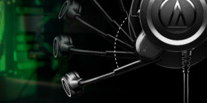 Close-up of a sleek, black headphone with a flexible microphone. The image shows the microphone in multiple positions, demonstrating its adjustability. A dashed arc highlights the range of motion, and a green tech background adds a modern feel—one of the best gaming headsets available. | FintechZoom