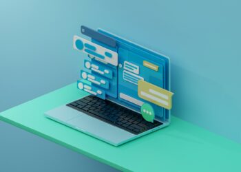 A stylized 3D illustration of a laptop with its display extending outwards, featuring various chat bubbles, text boxes, and user interface elements in shades of blue and green. The laptop, showcasing online payment methods, is placed on a green surface against a blue background. | FintechZoom