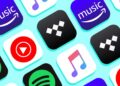 A grid of music streaming service app icons against a light blue background. The icons include logos for Amazon Music, YouTube Music, Tidal, Apple Music, and Spotify. The icons are arranged in a repetitive pattern. | FintechZoom