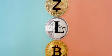 Three cryptocurrency coins aligned vertically against a two-toned background (orange on the right, green on the left). From top to bottom: Zcash with a "Z" symbol, Litecoin with an "L" symbol, and Bitcoin with a "B" symbol—perfect for transactions in crypto casinos. | FintechZoom