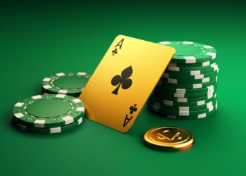 A green poker table with stacked green and white poker chips, an ace of clubs card leaning against the stacks, and a single gold coin featuring a spade symbol. The background is a smooth, gradient green. | FintechZoom