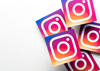 Five Instagram logo stickers arranged on a white background. The logos feature a gradient of purple, pink, and orange with a white camera outline. | FintechZoom