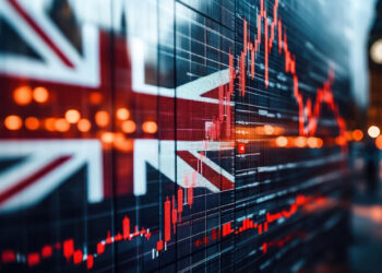 A digital stock market graph with fluctuating red lines, referencing the FTSE 100 Today, is superimposed over a blurred image of the British flag and London lights, with Big Ben visible in the background. | FintechZoom