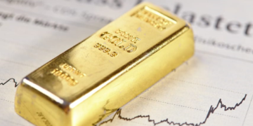 A gold bar rests on a document with financial graphs, its purity and weight inscribed. The scene evokes themes of investment, market analysis, and wealth management with Genesis Gold Group overseeing the path to prosperity. | FintechZoom