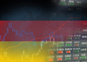 Stock market data overlaid with the German flag, featuring rising line graphs and numerical data against a dark background. The colors of the flag are prominent, symbolizing economic activity in Germany and highlighting insights on Fintechzoom.com about DAX40 performance. | FintechZoom