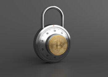 A silver combination lock with a Bitcoin symbol in the center stands against a dark gray background, evoking secure cryptocurrency practices. Discover more about safeguarding your investment with Bitcoin Security: Tips for Protecting Your Investment from FintechZoom.com. | FintechZoom