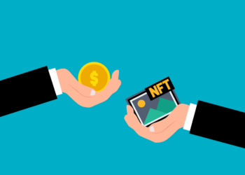 Illustration of one hand holding a gold coin with a dollar sign and another holding digital artwork labeled "NFT" against a blue background, symbolizing the dynamic trade in an NFT marketplace where cryptocurrency exchanges for non-fungible tokens. | FintechZoom