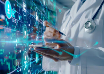 A person in a lab coat uses a tablet, overlaid with digital icons and graphics representing data and technology. The scene suggests medical technology or digital health innovation. | FintechZoom