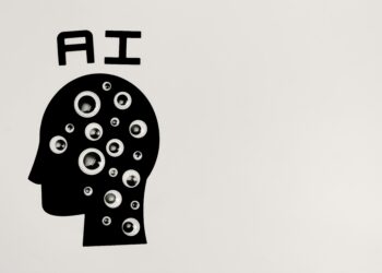 Silhouette of a head filled with various-sized googly eyes, with the letters "AI" above it, symbolizing artificial intelligence in modern financial decision-making. The backdrop is plain white. | FintechZoom