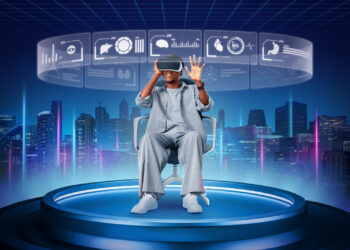 Person seated, wearing a virtual reality headset, interacts with holographic displays featuring charts and icons. In this realm where gaming technologies shape the virtual economy, a futuristic cityscape with illuminated skyscrapers and a digital grid sky comes to life in the background. | FintechZoom