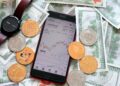 A smartphone displaying a cryptocurrency trading app shows a graph and $42,340.00. Surrounding it are digital coins with Bitcoin, Ethereum, and Dogecoin logos, a stylish wristwatch, and scattered U.S. dollar bills—perfect for those curious about how to buy Solana amidst the crypto buzz. | FintechZoom