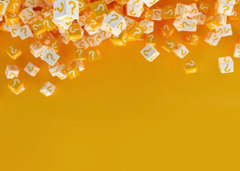 Numerous yellow and white cubes with question marks scatter across the top of a bright yellow background, evoking the excitement of discovering answers to the most frequently asked questions about free spins bonuses. The lower portion remains empty. | FintechZoom