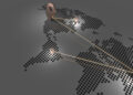 A stylized dotted world map with four metallic location pins connected by golden lines, representing how Emerging Nations Are Shaping Solutions for Global Challenges on a gray background. | FintechZoom