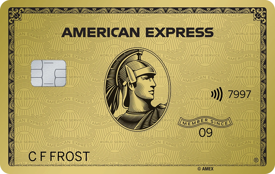 A gold American Express Business Credit Card featuring a centurion in the center, a chip on the left, contactless symbol, card number ending in 7997, and the name C F Frost at the bottom. | FintechZoom