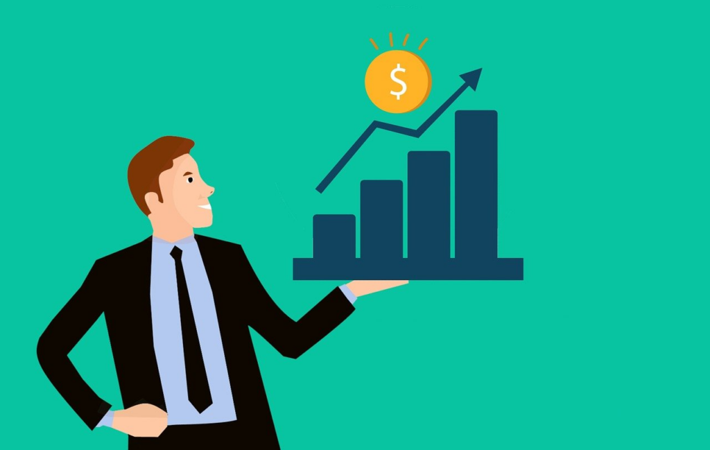 A man in a suit holds a rising bar graph with an upward arrow and a gold coin with a dollar sign above it, symbolizing financial growth or business success, on a teal background. | FintechZoom