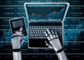 A robot with metallic hands uses a laptop and holds a smartphone displaying financial data, with stock market charts and numbers shown on the computer screens and background. | FintechZoom