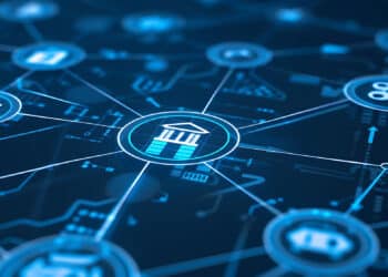 Digital illustration of interconnected icons on a blue network, featuring a central bank symbol linked to finance, cloud, and technology icons, representing digital banking and financial technology. | FintechZoom