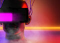 A futuristic mannequin head wearing a large, glowing virtual reality headset with cables attached, surrounded by colourful neon lights and mist in a sci-fi setting. | FintechZoom