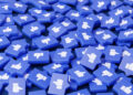 A pile of blue 3D buttons featuring white thumbs-up and thumbs-down symbols, representing social media likes and dislikes, scattered randomly across the surface. | FintechZoom